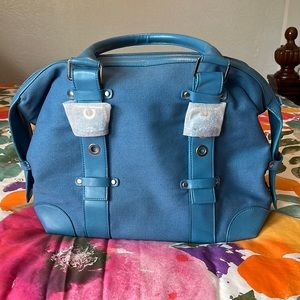 NWOT No brand blue canvas handbag with adjustable handles.